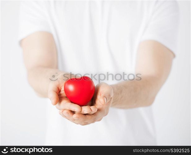 close up of man hands with heart