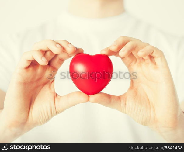 close up of man hands with heart