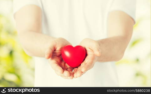 close up of man hands with heart