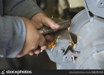 Close up of man in workshop with tools