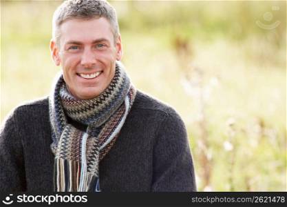 Close Up Of Man Outdoors Walking In Autumn Landscape