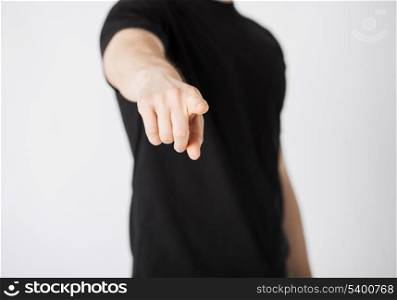 close up of man pointing his finger at you