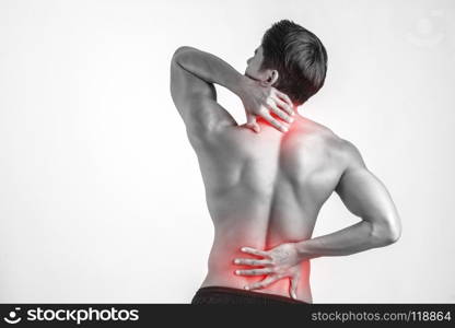 Close up of man rubbing his painful back isolated on white background.. Close up of man rubbing his painful back isolated on white backg