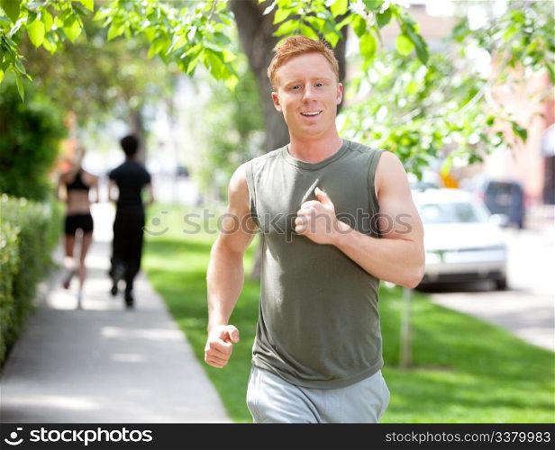 Close-up of man running against blur background