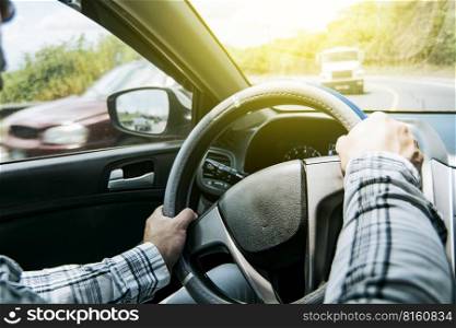 Close up of man’s hands on the wheel, a person driving with hands on the wheel, A man with hands on the wheel of the car, Concept of hands on the wheel of a car