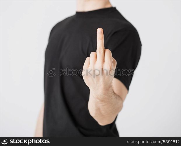 close up of man showing middle finger