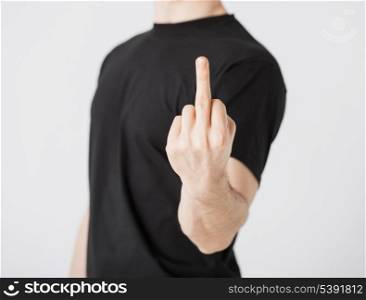close up of man showing middle finger