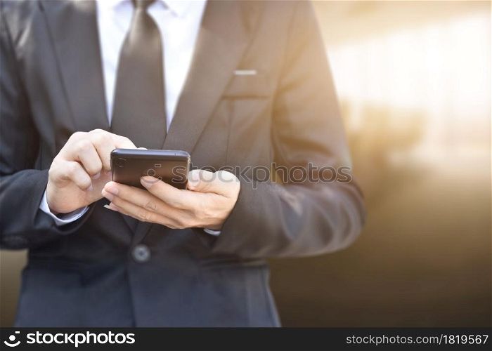 Close up of man using mobile smartphone. Business and technology concept.