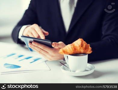 close up of man with tablet pc and cup of coffee