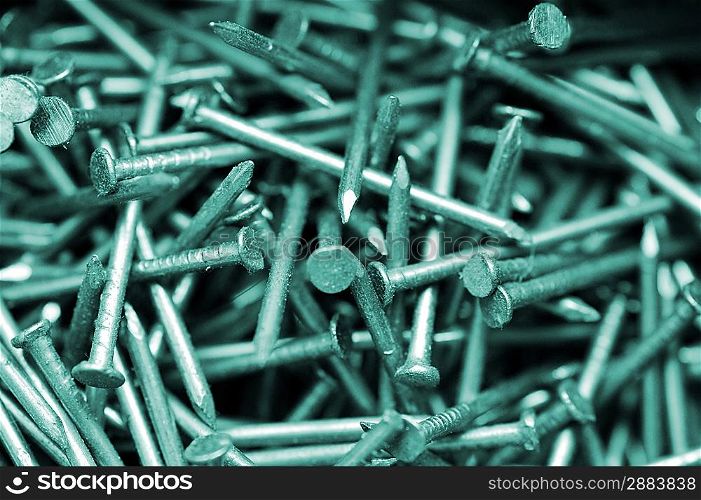 Close up of many metal nails in box