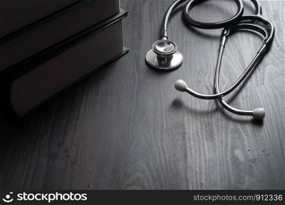 Close-up Of Medical Stethoscope On desk with books
