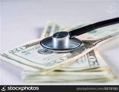 Close up of medical stethoscope on dollar bills isolated. Medical health cost concept, stethoscope with money