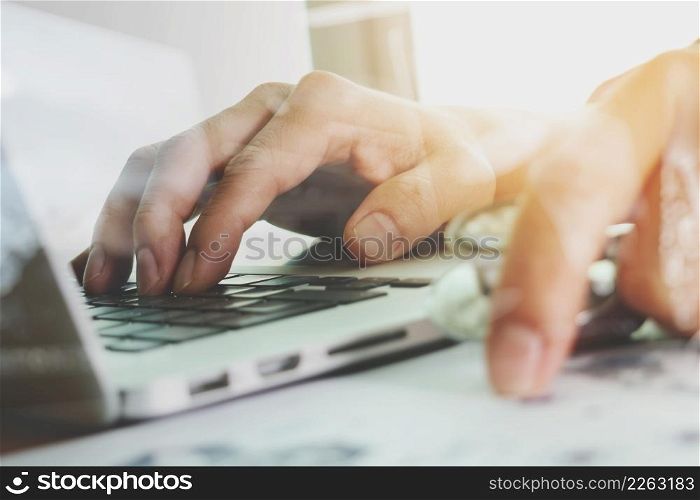 close up of Medicine doctor hand working with modern computer and medical diagram on wooden desk as medical concept