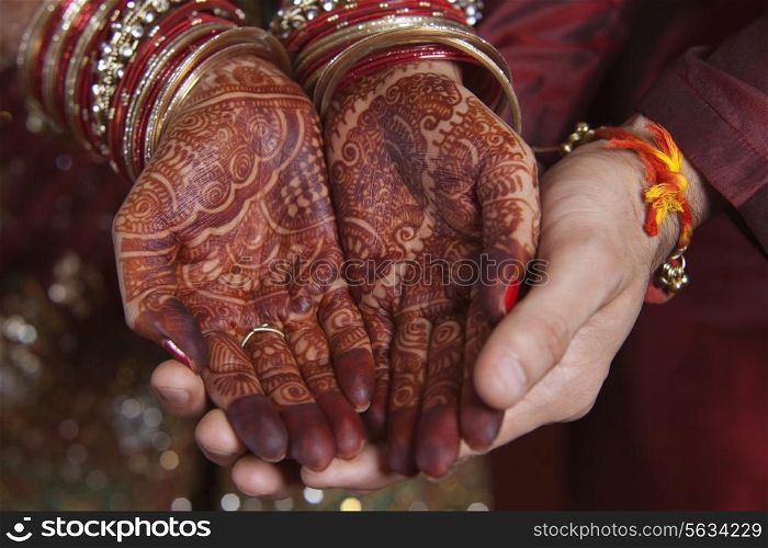 Close-up of mendi on a brides hands