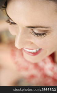 Close-up of mid-adult Caucasian woman smiling.