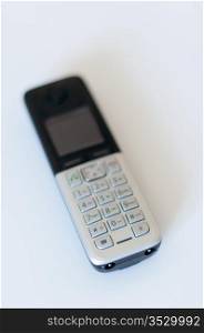 Close Up of Modern Cordless Black and Silver DECT Phone on White Background