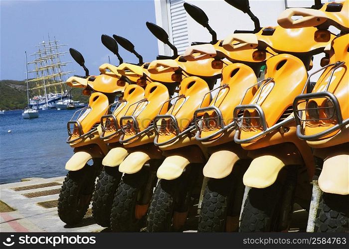 Close-up of motor scooters in a row