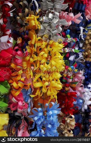 Close-up of multi-colored hair bows at a market stall