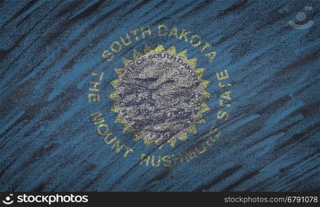 Close-up of national South Dakota state flag painted with colored chalk on a blackboard.&#xA;
