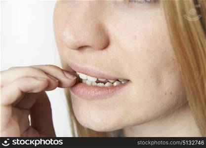 Close Up Of Nervous Woman Biting Nails