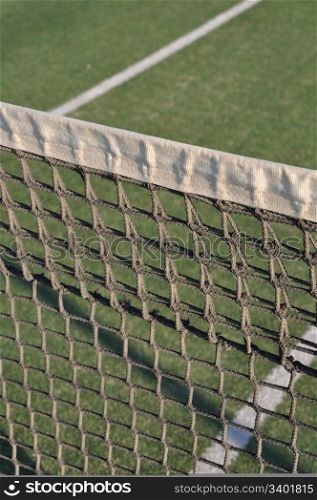 close-up of net on an outdoor tennis court