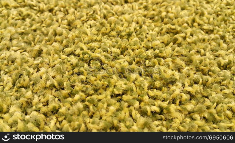 Close-up of new yellow carpet texture