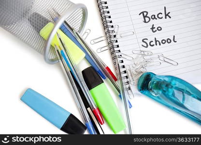 Close-up of office supplies with spiral notebook