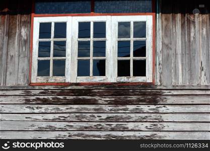 Close up of old fashioned wooden house windows in Thailand