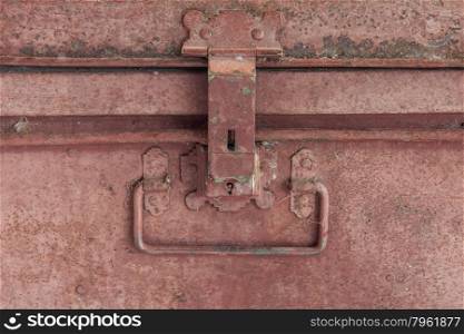 Close up of old rusty casket at the lock and handle