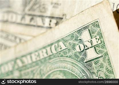 Close up of one dollar bill with shallow focus