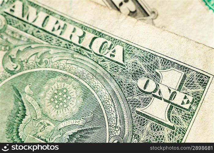 Close up of one dollar bill with shallow focus