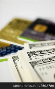 Close-up of one hundred dollar bills with credit cards