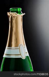 Close-up of open champaign bottle with label