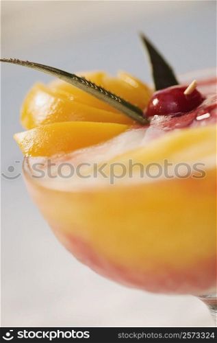 Close-up of orange juice in a stem glass