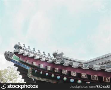 Close-up of ornate roof tiles on Chinese building.