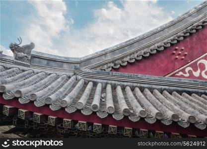 Close-up of ornate roof tiles on Chinese building.