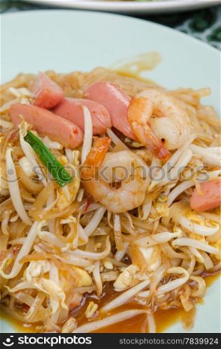 close up of Pad Thai , stir fried noodles with shrimp ,sausage , egg and vegetable