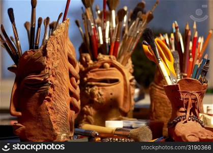 Close-up of paintbrushes in a holder