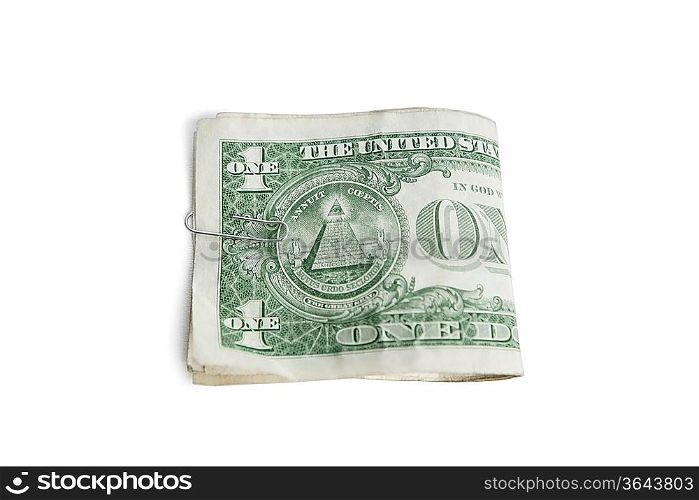 Close-up of paper dollars in clip over white background