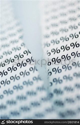 Close-up of paper with percentage sings