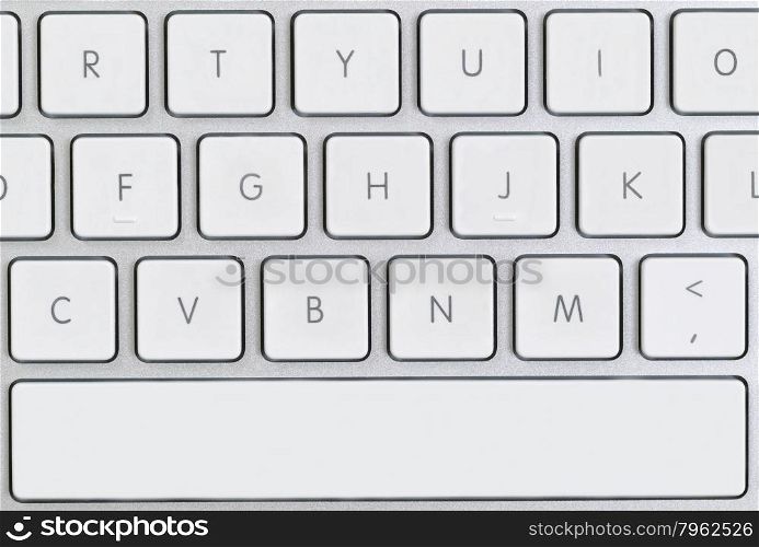 Close up of partial computer keyboard in filled frame layout.