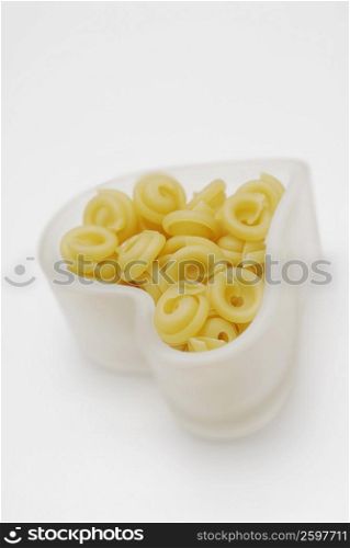 Close-up of pasta in a heart shape bowl