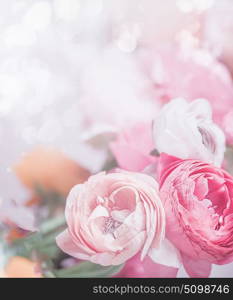 Close up of pastel pink flowers at bokeh background. Festive greeting card