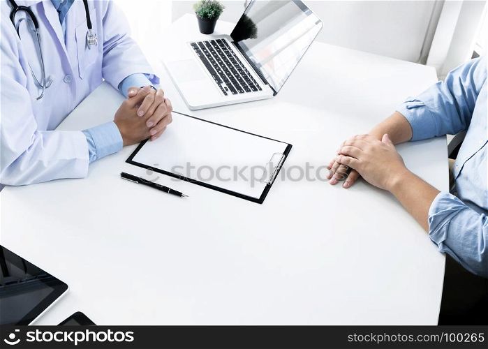 close up of patient and consultant doctor give an advice in a hospital or clinic
