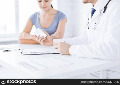 close up of patient and doctor prescribing medication
