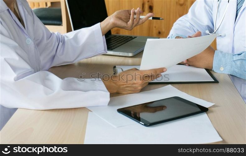 close up of patient and doctor taking notes or Professional medical doctor in white uniform gown coat interview.
