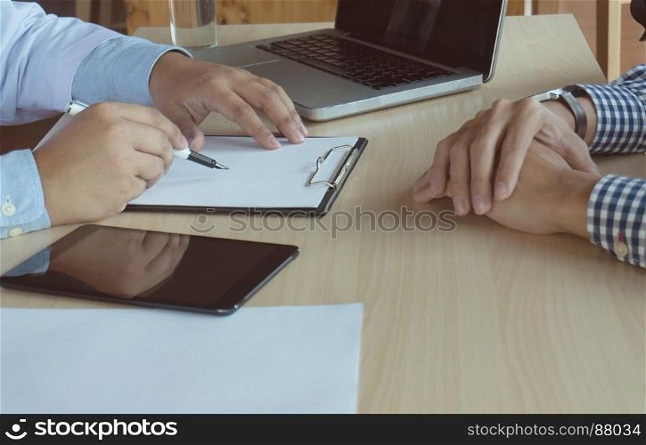 close up of patient and doctor taking notes or Professional medical doctor in white uniform gown coat interview.