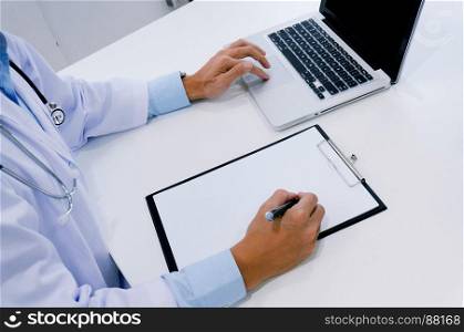 close up of patient and doctor taking notes or Professional medical doctor in white uniform gown coat interview