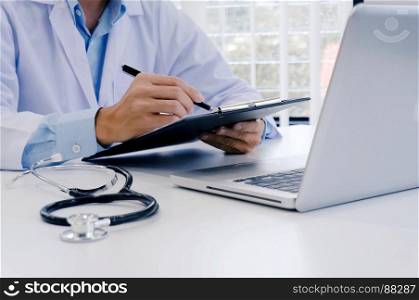 close up of patient and doctor taking notes or Professional medical doctor in white uniform gown coat interview