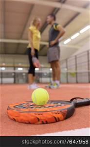 close up of people playing racket ball